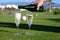 Pouring of bubbles white champagne or cava wine during golf competition event or celebration on green golf club grass with