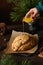 Pouring butter on Christmas stollen. Close up