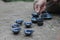 Pouring Chinese Tea at Run River and mountain cliffs background