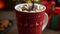 Pouring Chocolate Sauce over Marshmallows in a Red Mug of Hot Cocoa - Christmas Atmosphere by the Fireplace