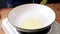 Pouring coconut oil into pan. Preparing for cook.