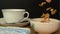 Pouring Cornflakes and Froot Loops into a white bowl