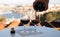 Pouring of fortified dessert ruby, tawny port wines in glasses with view on Douro river, porto lodges of Vila Nova de Gaia and