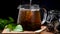 Pouring fresh, hot tea in a glass cup and dry loose leaves, dark moody background