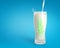 Pouring fresh milk in glass with strong spine on blue background. Healthy drink background.