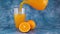 Pouring fresh squeezed orange juice in glass