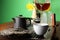 Pouring freshly brewed pu-erh tea into cup on table, closeup