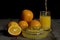 Pouring freshly squeezed orange juice into glass