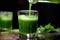 pouring green juice shot in slow motion