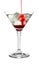 Pouring grenadine into glass of martini cocktail