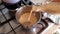 Pouring home made plant milk in a pan