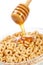 Pouring honey on cornflakes