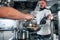 Pouring ingredients. Professional chef preparing food in the kitchen