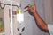 Pouring the medicine into the bottle with a syringe, doctor`s hand holds a syringe and a Infusion bottle at the hospital. Health