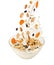 Pouring milk and falling muesli over a transparent bowl. Isolated on white.