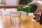 Pouring mineral water into the glass