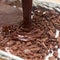 Pouring mixture of chocolate eggs and flour