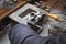 Pouring molten lead alloy into a mold. Workshop.