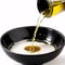 Pouring olive oil on a white background.