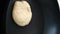 Pouring pancake dough on a cooking pan