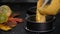 Pouring pumpkin cake batter into a baking dish.