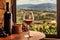 pouring red wine into glass with vineyard view