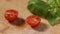 Pouring salt over one chopped cherry tomato