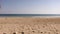 Pouring sand in woman`s hand. Sand is falling through her fingers.Woman pours beach sand from her hands.