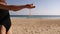 Pouring sand in woman`s hand. Sand is falling through her fingers.Woman pours beach sand from her hands.