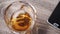 Pouring a scotch whiskey on the ice Euro symbol