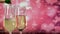 Pouring sparkling champagne into glasses over abstract pink background.