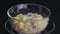 Pouring sticky rice balls, ginkgo fruit and coconut meat into transparent bowl and follow by sweet coconut milk.