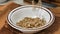 Pouring sunflower seeds into a bowl super slow motion