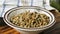 Pouring sunflower seeds into a small bowl