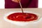 Pouring tomato sauce