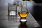 Pouring in tulip-shaped tasting glass Scotch single malt or blended whisky