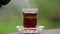 Pouring Turkish Tea to Tea Glass close up