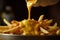 Pouring Velvety Cheddar Cheese Over Crispy French Fries for a Mouthwatering Delight. created with Generative AI