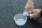 Pouring water from bottle into cup for share good