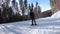POV beginner girl on skis and amateur skiers slide down on ski slope at ski resort