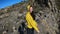 POV, carefree couple high fives standing on top of mountain