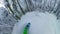 POV: Carving the fresh snow through the stunning coniferous forest in the Alps.