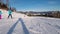 POV Downhill Skiing on Ski Slope at a Ski Resort. People Skiing on a Slope