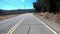 POV Driving Down An Empty Two Lane Road In California