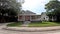 POV driving street pan S Florida Ave homes and summer green foliage