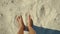 POV first person view of female feets walking on white sand with shells on beach at hot summer sunny day. relax and