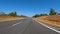 POV FPV driving newly paved long highway clear blue sky Georgia USA