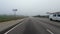 POV FPV rear view driving on the interstate I-20 distant traffic and fog