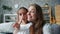 POV of funny woman and girl mother and daughter making funny faces taking selfie