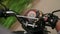 POV of a motorcycle rider passenger on a rural road in Sri Lanka. Over the shoulder shot of biker riding motorbike on